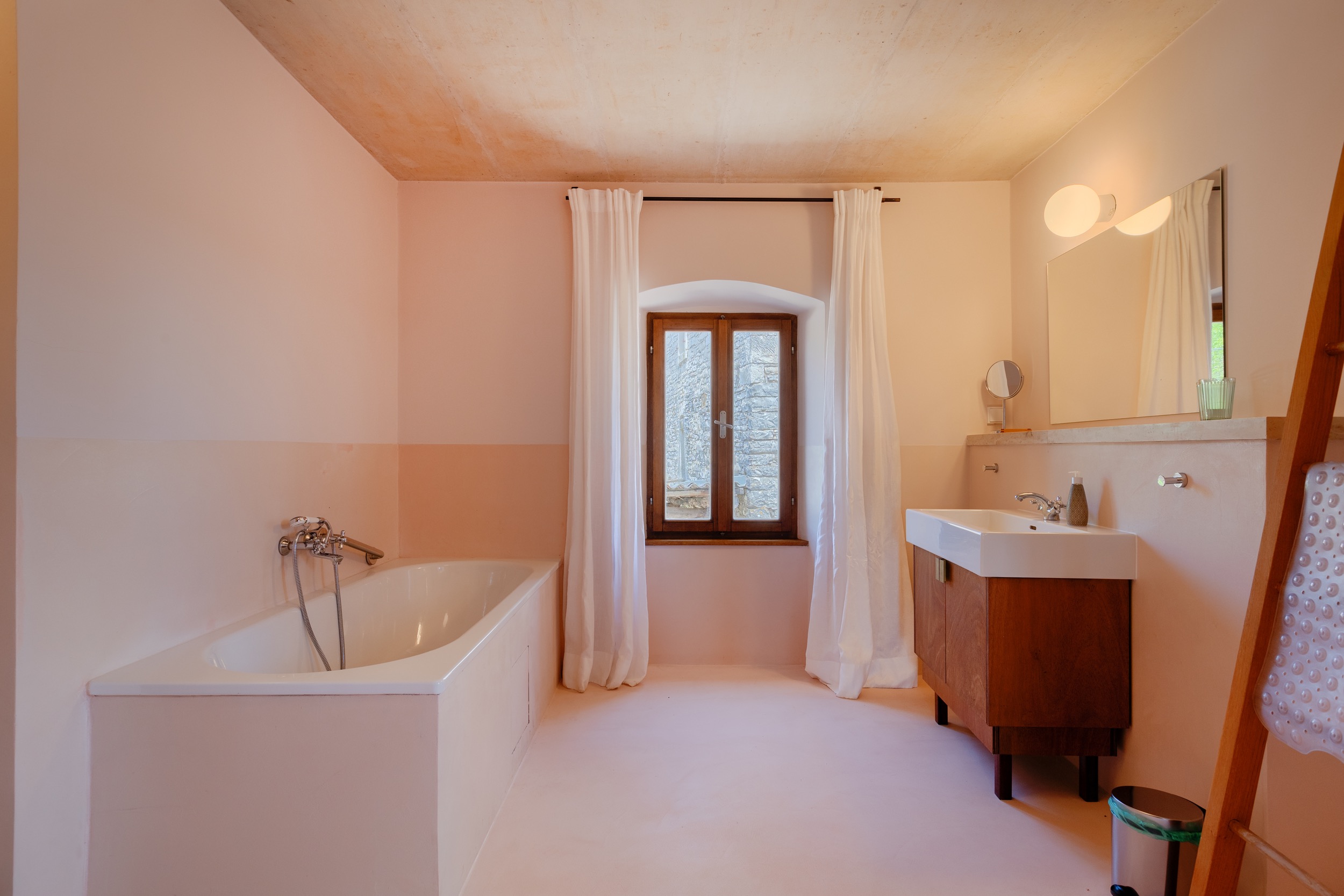 casa ceppi istria croatia interior bathroom bathtub arched window wooden vanity