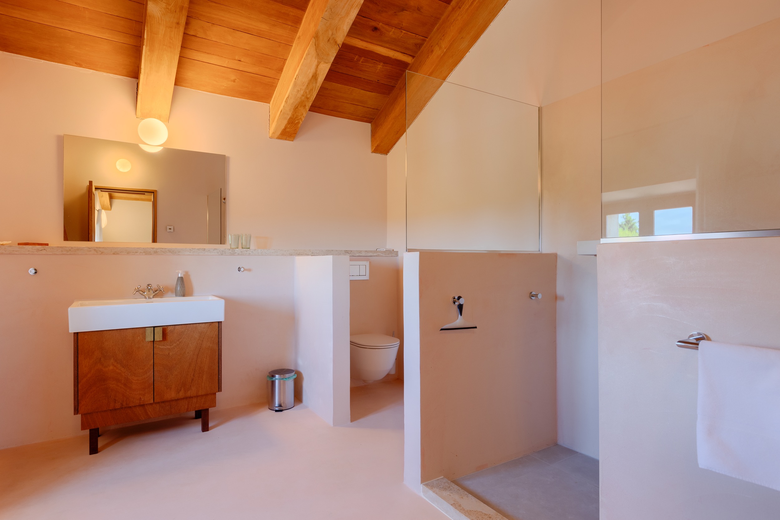 casa ceppi istria croatia interior bathroom wood beam ceiling vanity walk in shower